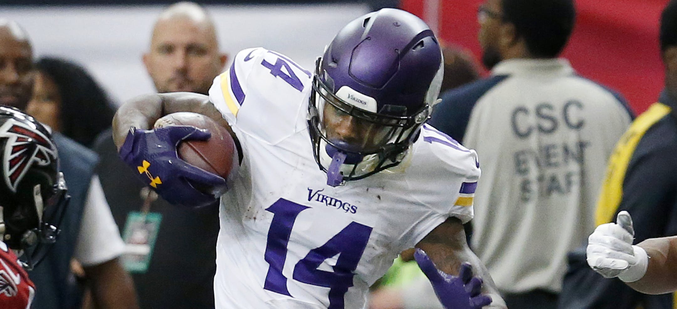 Stefon Diggs (14) attempted to avoid Atlanta defenders to get a first down in the first quarter. ] CARLOS GONZALEZ ï cgonzalez@startribune.com - November 29, 2015, Atlanta, GA, Georgia Dome, NFL, Minnesota Vikings vs. Atlanta Falcons