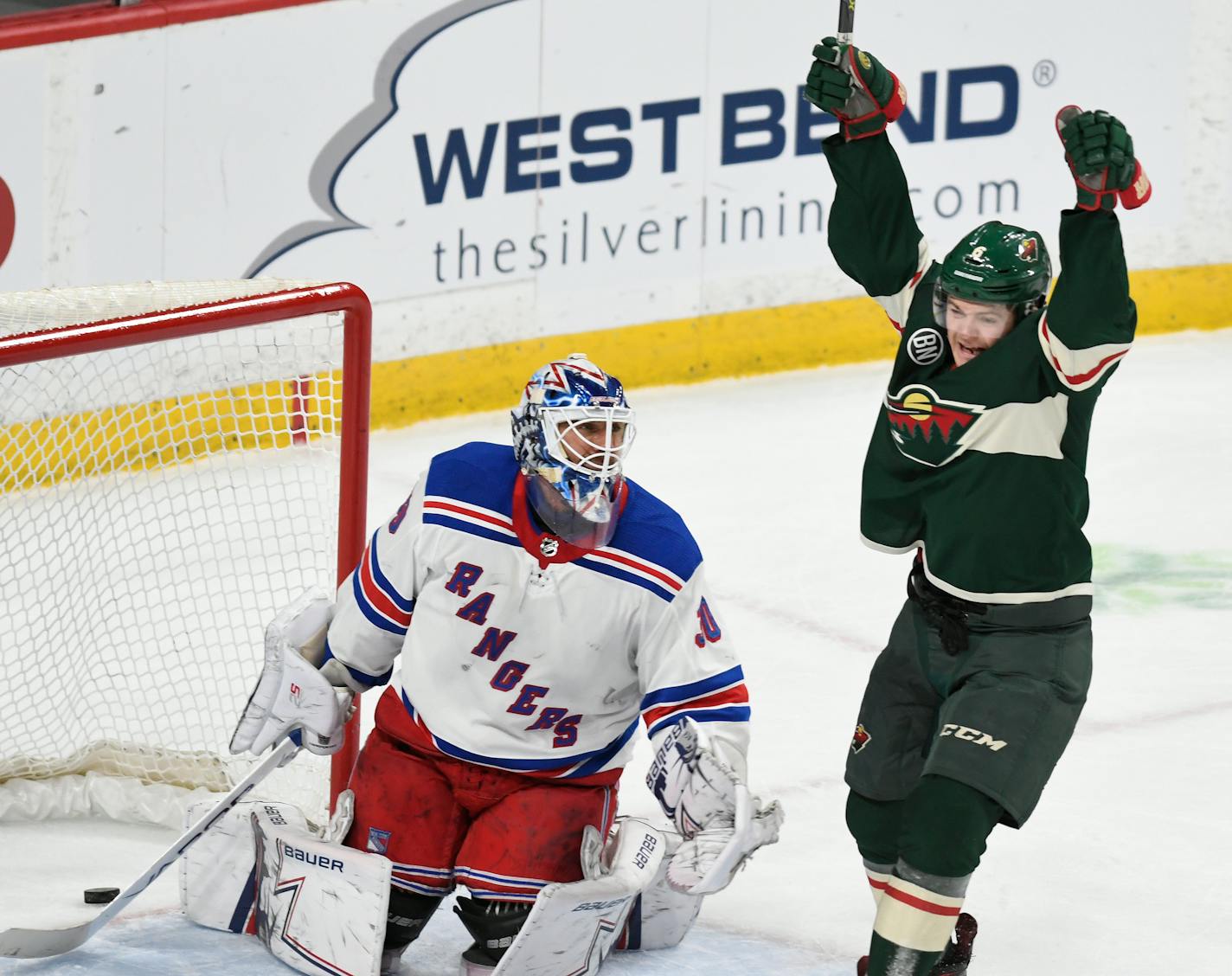 The Wild's Ryan Donato celebrates his second goal in front of New York Rangers goalie Henrik Lundqvist