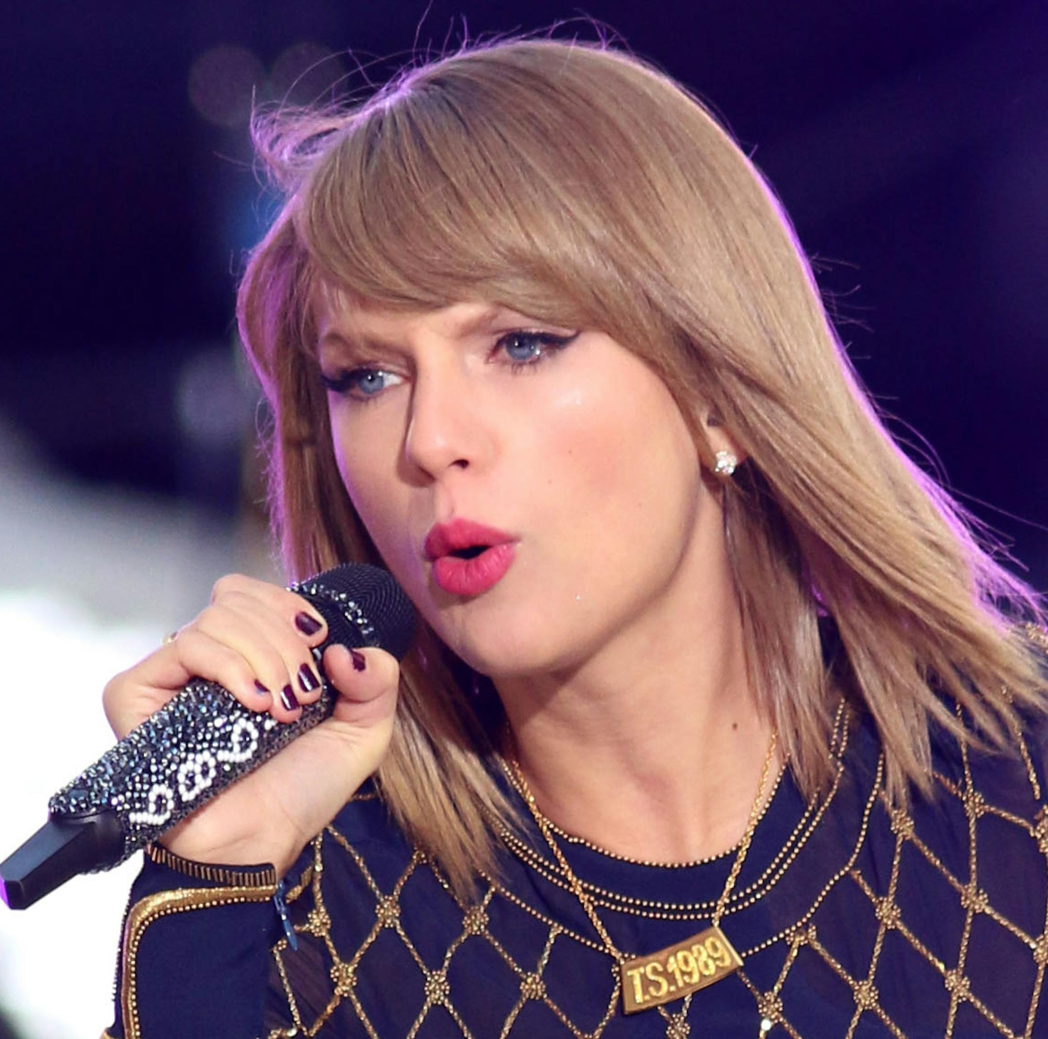 FILE - In this Oct. 30, 2014 file photo, Taylor Swift performs on ABC's "Good Morning America" in Times Square in New York. The music industry tracker says it's transforming the Billboard 200 chart from a sales-based ranking to one that better measures music consumption. This move comes after music acts like Swift and Jason Aldean pulled their tunes from Spotify. (Photo by Greg Allen/Invision/AP, File)