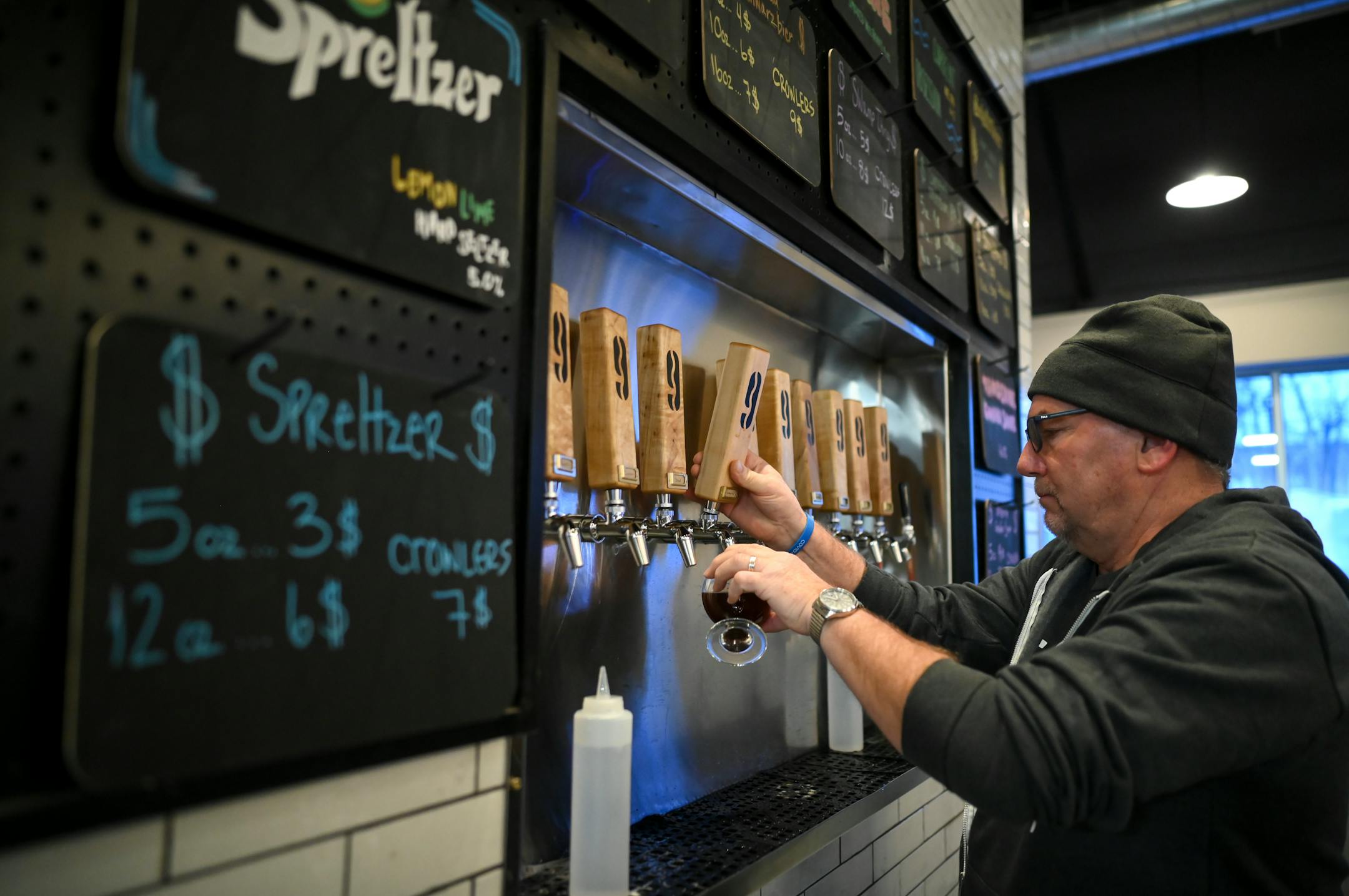 Nine Mile Brewing beertender Tim O'Harris poured  a Nein Brau Schwarzbier.