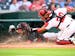 Twins center fielder Byron Buxton is tagged out by Nationals catcher Keibert Ruiz as he attempts to score from first on a double by Willi Castro durin