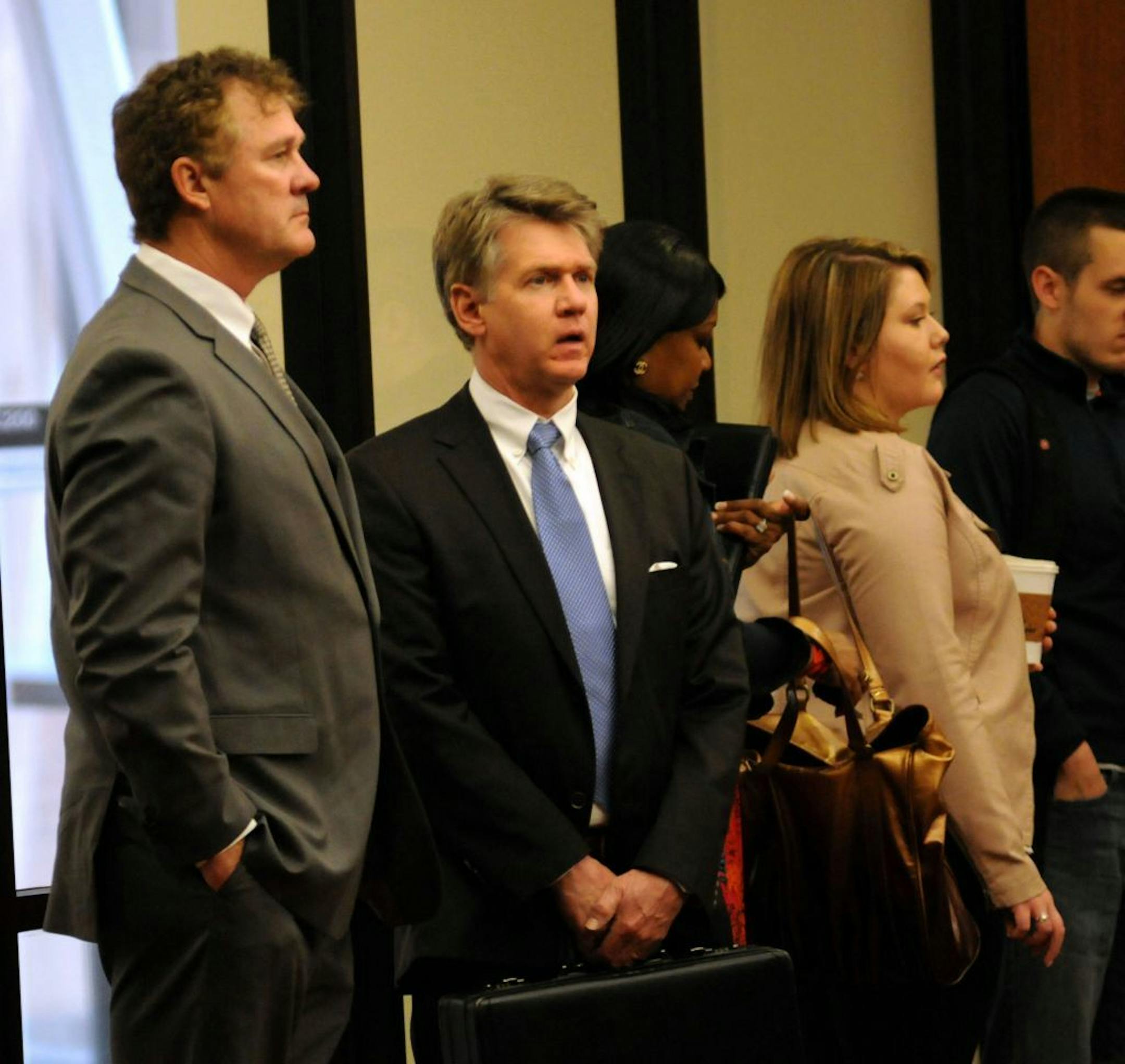 Joe Senser stood in a security line with Marsh Halberg criminal defense attorney, in the Hennepin County Government Center on Thursday morning April 26, 2012 . Joe Senser's wife amy had arrived earlier. Amy Senser is charged with felony criminal vehicular homicide in the Aug. 23, 2011, death of Anousone Phanthavong, whom she struck and killed as he filled his car with gas on the Interstate 94 ramp at Riverside Avenue just east of downtown Minneapolis. .