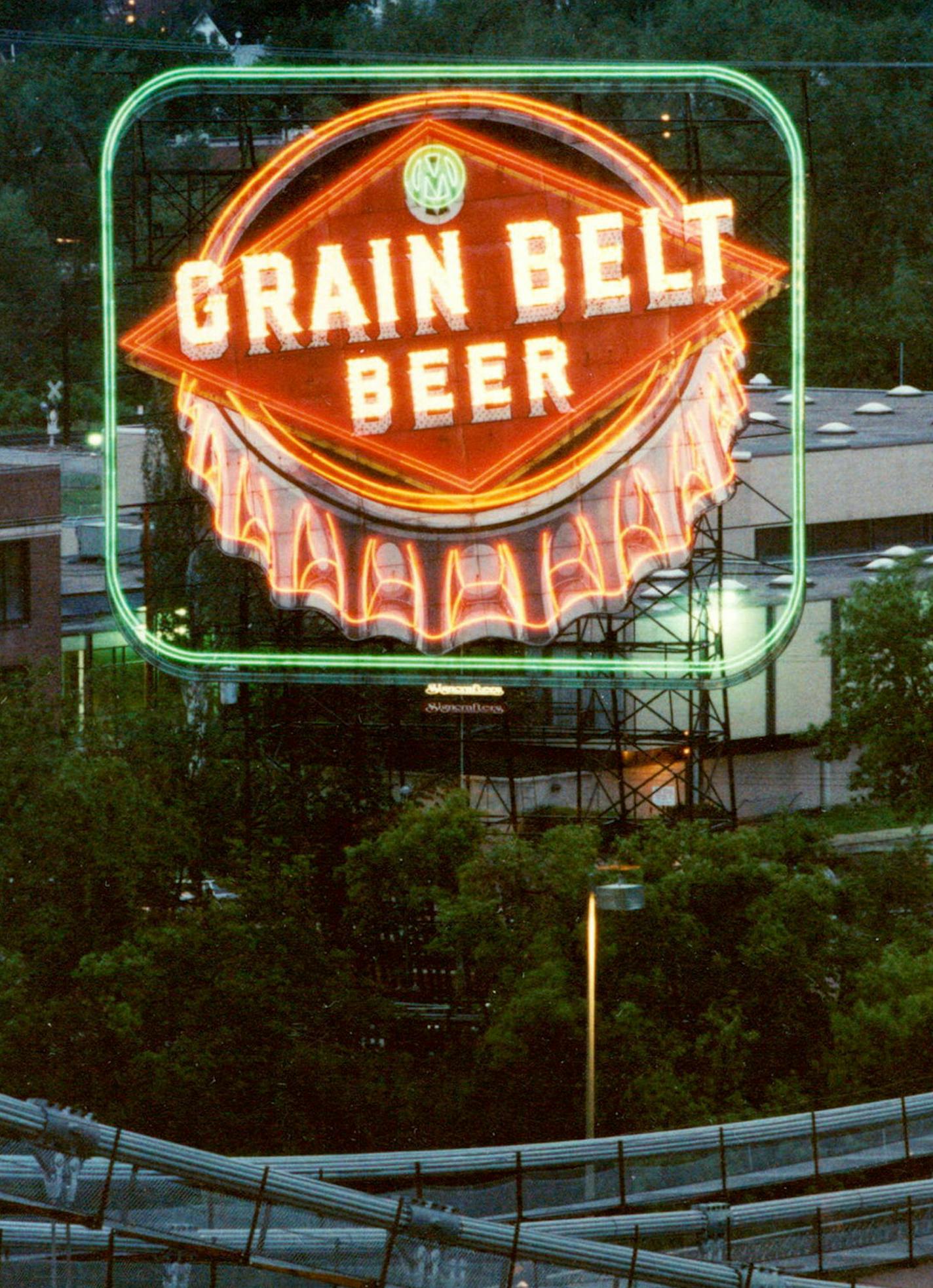 May 25, 1989 The glow is back A Minneapolis landmark, the Grain Belt Beer bottle-cap sign on Nicollet Island near the Hennepin Av. Bridge, was relit Wednesday after 14 years in the dark. A crowd of about 200 people gathered for a short ceremony last night to watch the 1940 sign come back to life. Story on page 5B. May 24, 1989 David Brewster, Minneapolis Star Tribune ORG XMIT: MIN2015011410441042