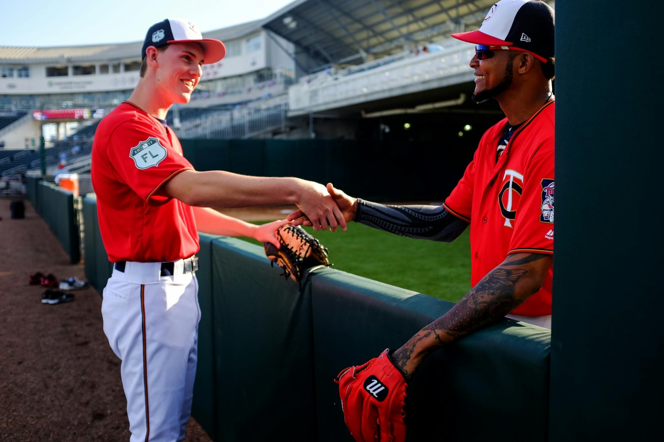 Twins pitcher Ervin Santana, right, shook hands with bat boy Bobby Allen, of Sarasota, before Friday night's game.