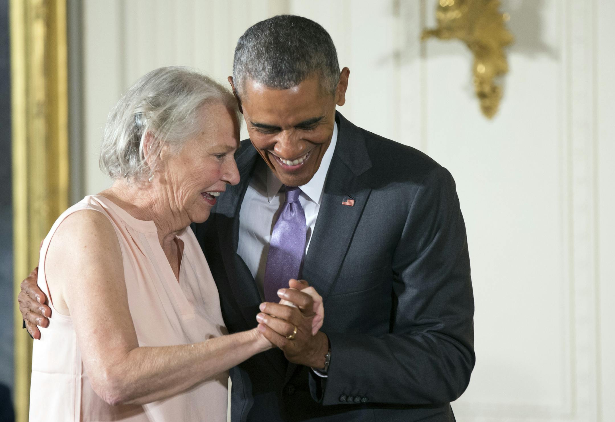 President Barack Obama awards the 2014 National Humanities Medal to author Annie Dillard of Key West, Fla., during a ceremony in the East Room at the White House in Washington, Thursday, Sept. 10, 2015. (AP Photo/Andrew Harnik)