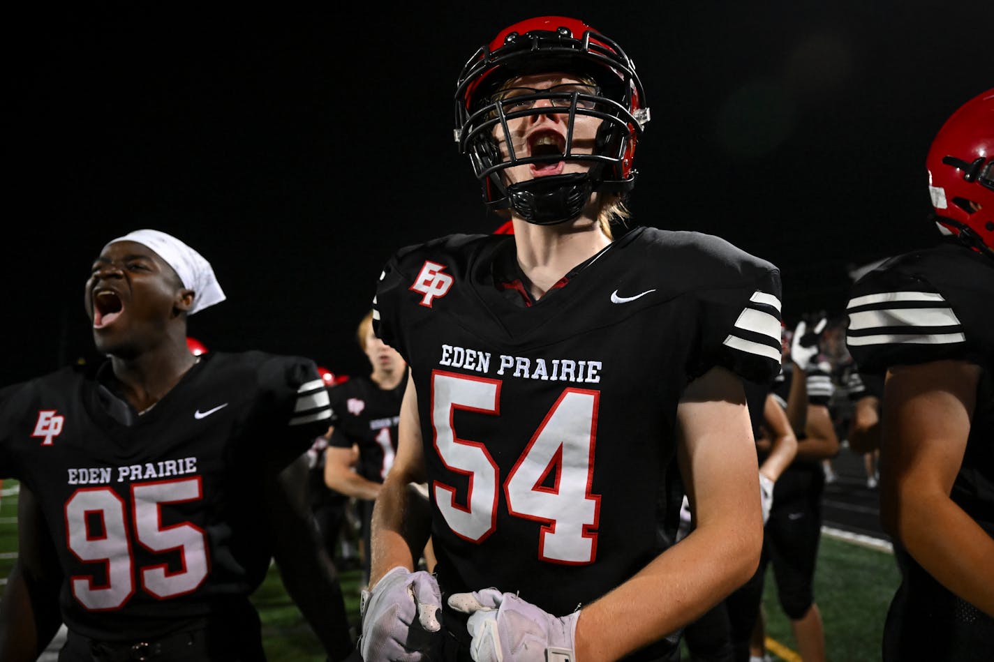 Eden Prairie offensive guard Wilson McMurry (54) celebrates a touchdown scored by running back Liam Berndt (4) in the second half Friday, Sept. 22, 2023 at Eden Prairie High School in Eden Prairie, Minn. ] AARON LAVINSKY • aaron.lavinsky@startribune.com