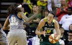 Seattle Storm's Breanna Stewart (30) drives as Minnesota Lynx's Seimone Augustus defends in the second half of a WNBA basketball game Sunday, May 22, 