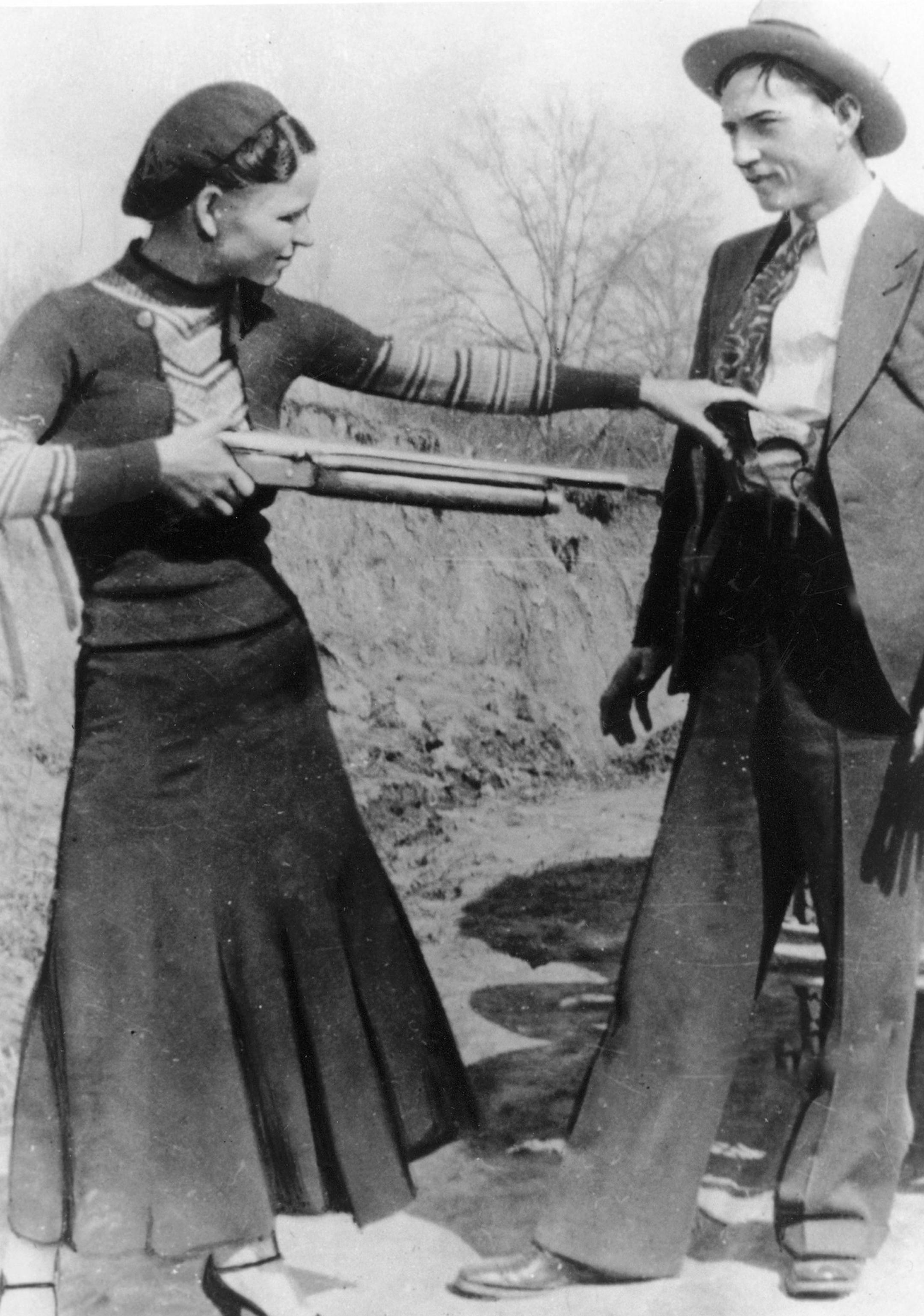 FILE - This this undated file photo shows outlaws and lovers Bonnie Parker, left, and Clyde Barrow. Guns and other items connected to the couple are going on auction by RR Auction of Amherst, N.H. An auction official estimated Thursday, July 12, 2012, that the handguns found on the duo after they were shot dead each could fetch between $100,000 and $200,000. (AP Photo/File) ORG XMIT: MIN2013083014282128