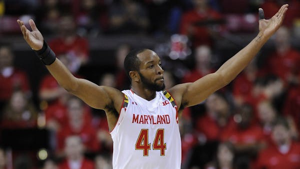 Maryland guard Dez Wells calls to the crowd after his team took a significant lead over Oakland during the second half of an NCAA college basketball g