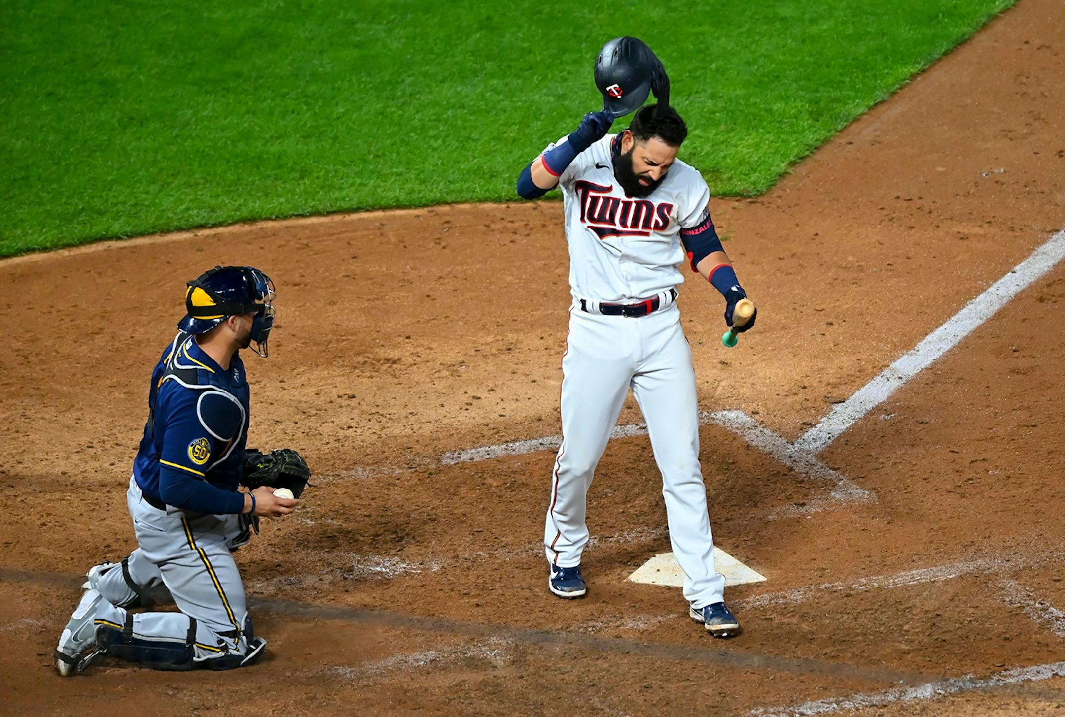 Minnesota Twins third baseman Marwin Gonzalez (9) had some choice words for home plate umpire Jeremie Rehak after Gonzalez was out on a called strike in the bottom of the 10th inning.