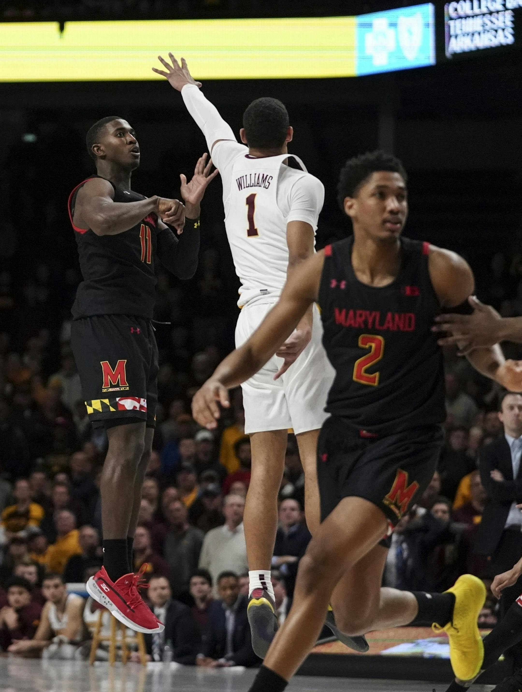 Maryland Terrapins guard Darryl Morsell (11) shot a three point shot to win the game by one point in the final seconds of the second half.