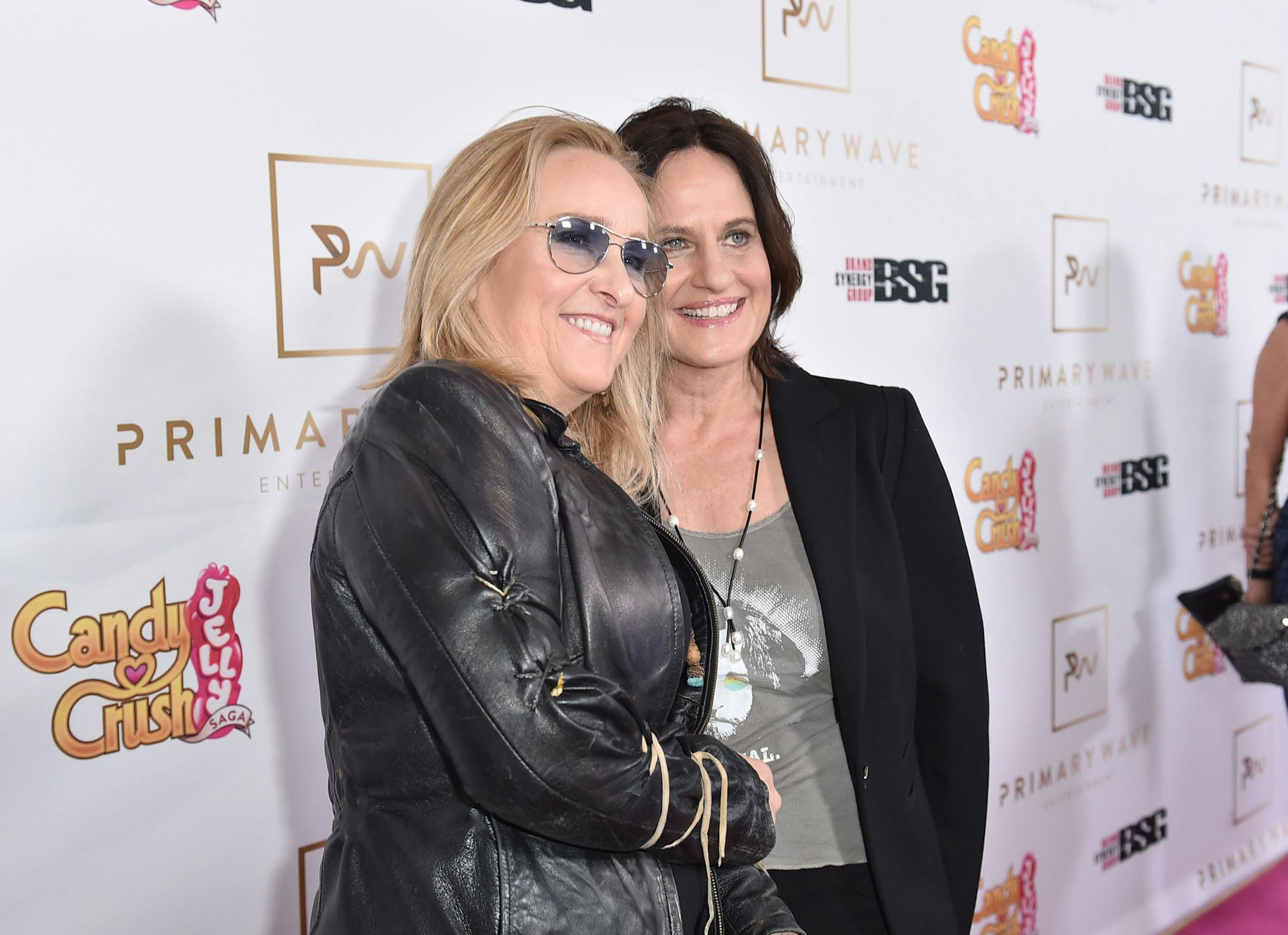 Melissa Etheridge, left, and Linda Wallem arrive at the Candy Crush Jelly Saga - Primary Wave Pre-Grammy Party at The London Hotel on Sunday, Feb. 14, 2016, in Los Angeles. (Photo by Jordan Strauss/Invision for Ketchum (New York)/AP Images)
