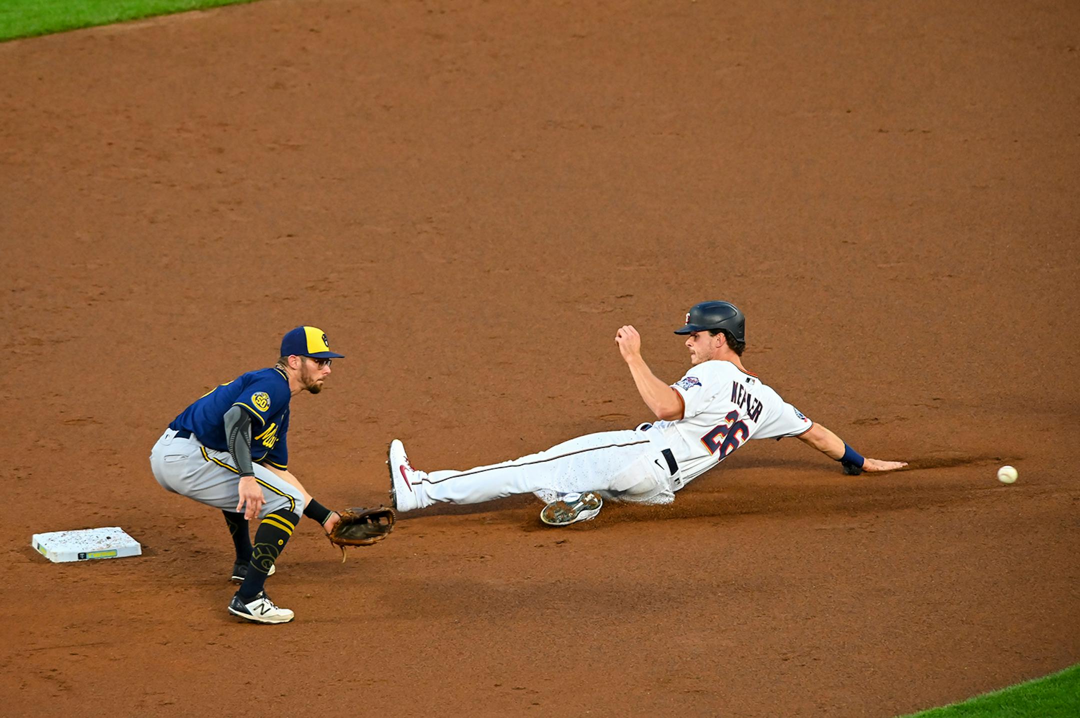 Minnesota Twins right fielder Max Kepler (26) stole second in the bottom of the third inning as Milwaukee Brewers second baseman Eric Sogard (7) tried to get the tag.