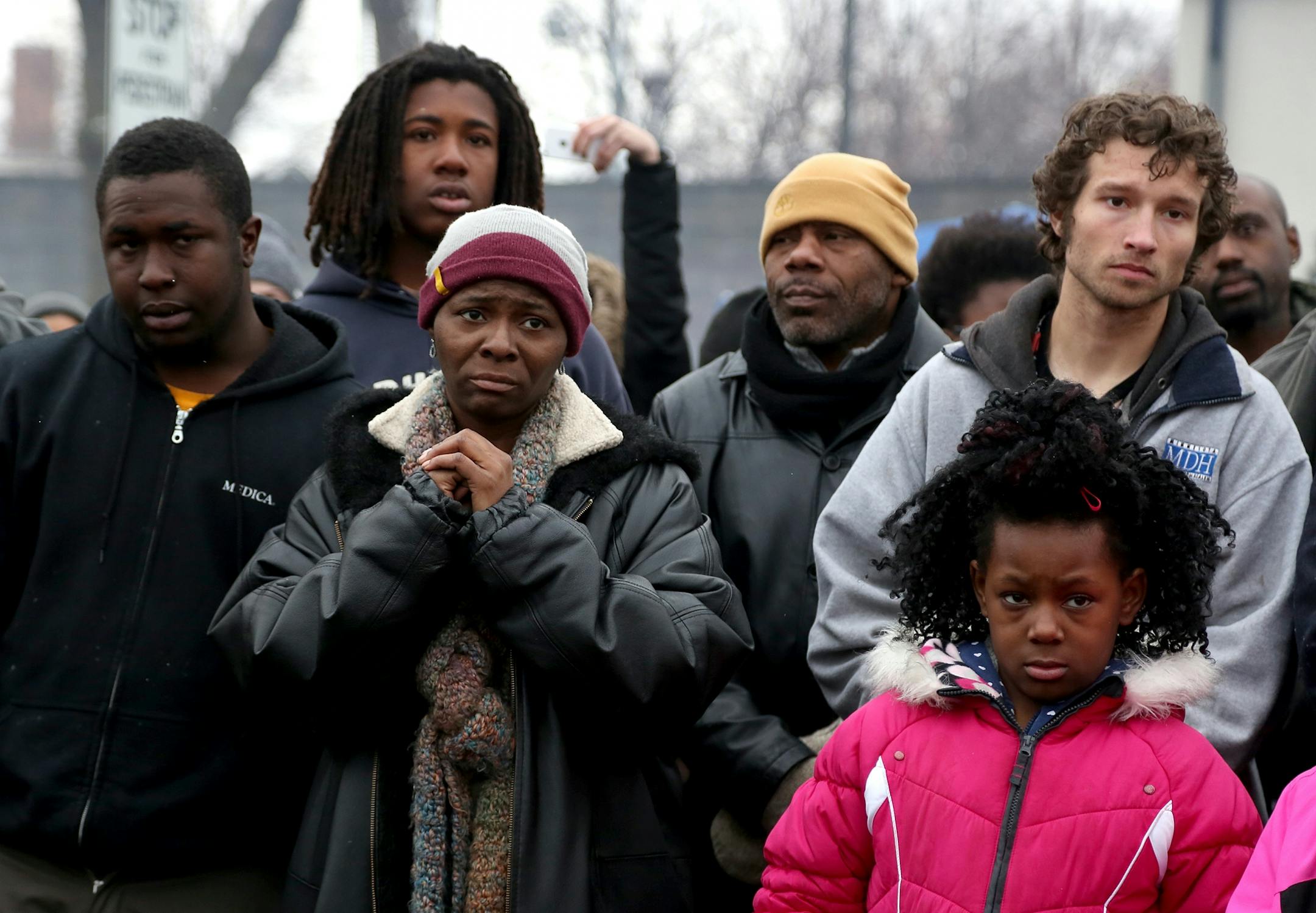 Community members and protesters listened as NAACP Minneapolis president Nekima Levy-Pounds addressed the group during BlackGiving event in front of the Minneapolis Fourth Precinct.