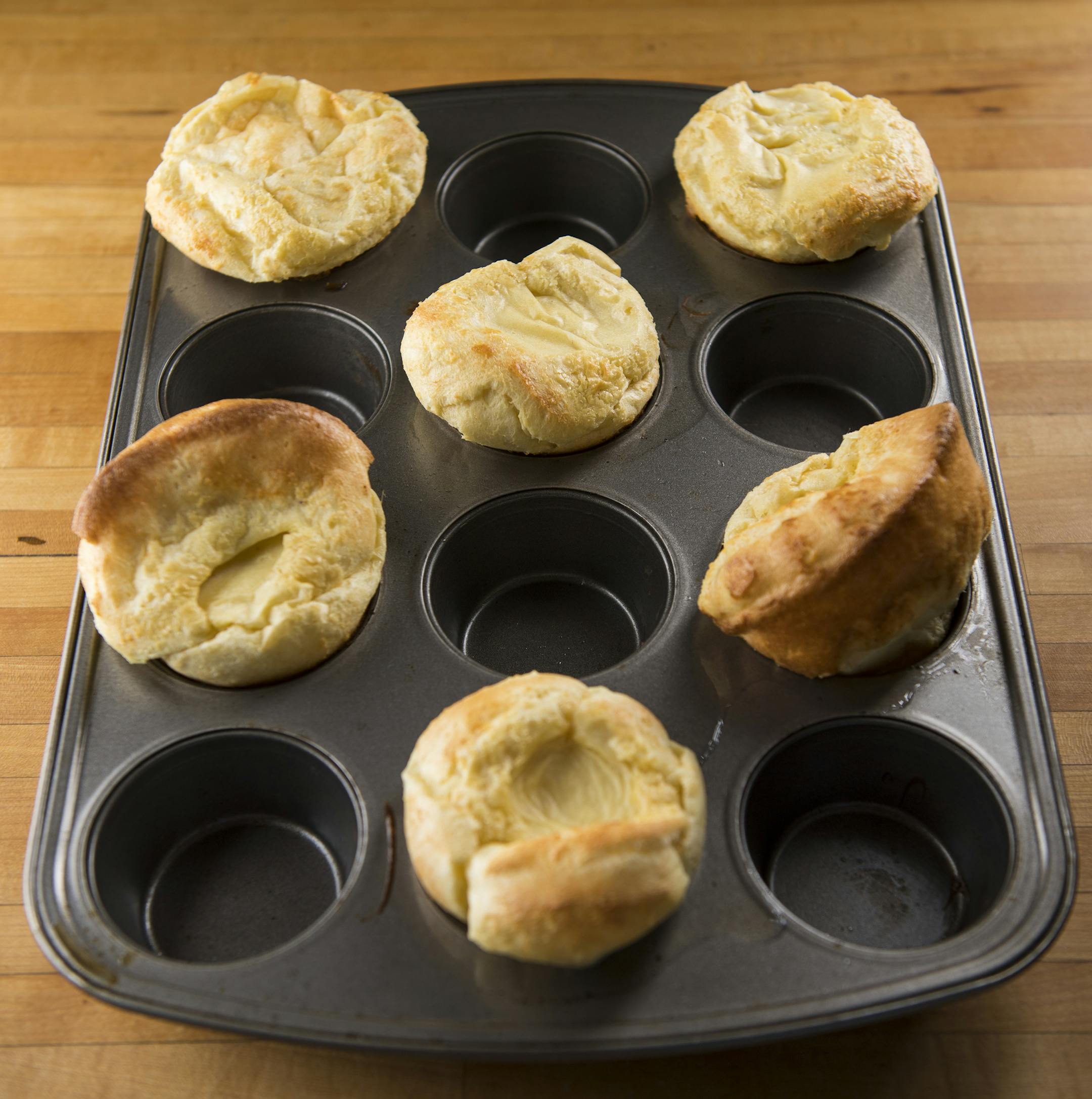 Step 6: After taking Dutch Puffs out of the oven, they will have risen, but will quickly deflate. Once they're deflated, add blueberry compote. ] Isaac Hale ï isaac.hale@startribune.com Baking Central: Making Dutch Puffs in muffin tin and blueberry compote on Wednesday, July 13, 2016.