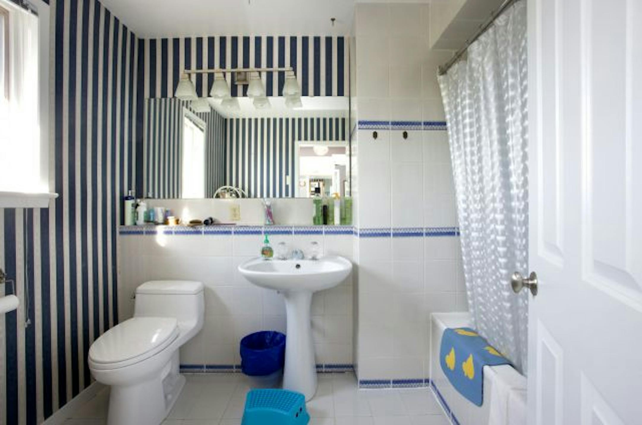 Before: This bathroom was cramped, cluttered and dingy.