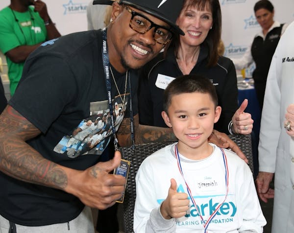 Ted Ginn Jr. of the Carolina Panthers celebrated as Jeremiah received a free hearing aid at a pre-Super Bowl bash in California sponsored by the Stark