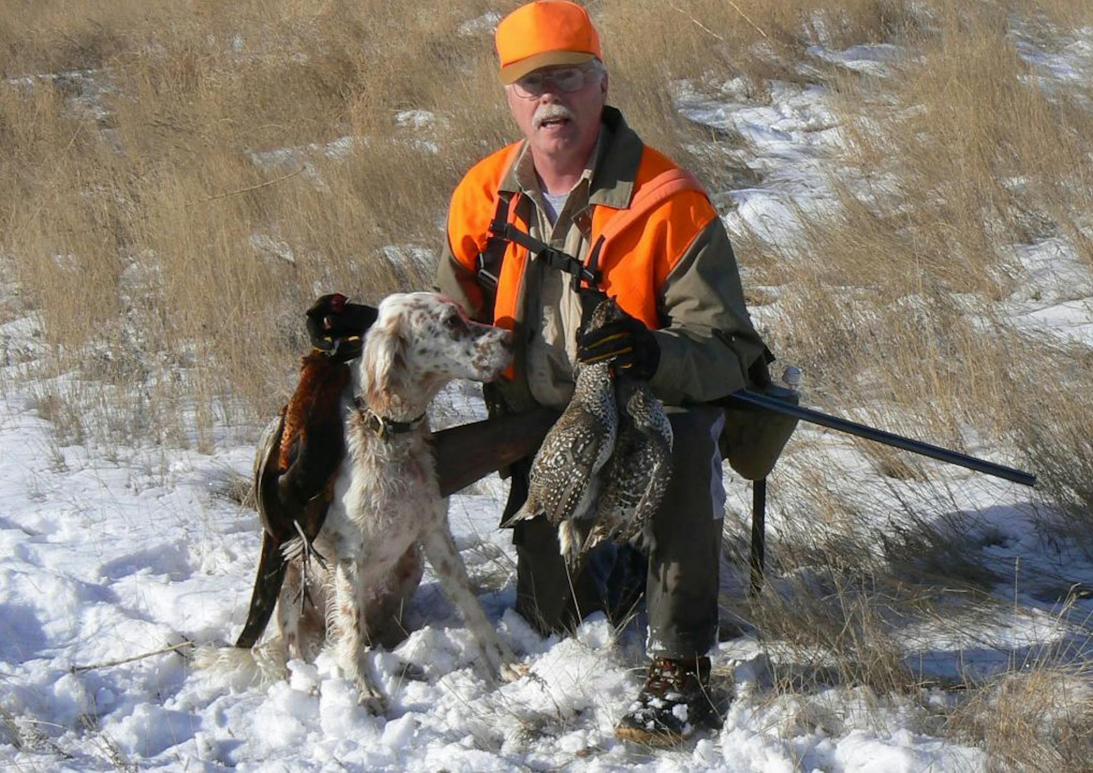 Norm Moody and his blind English setter, Golly, during a fruitful South Dakota bird hunt. Though Golly is blind, he still hunts using his other senses. Moody hunts him on the prairies, where he's unlikely to run into anything.