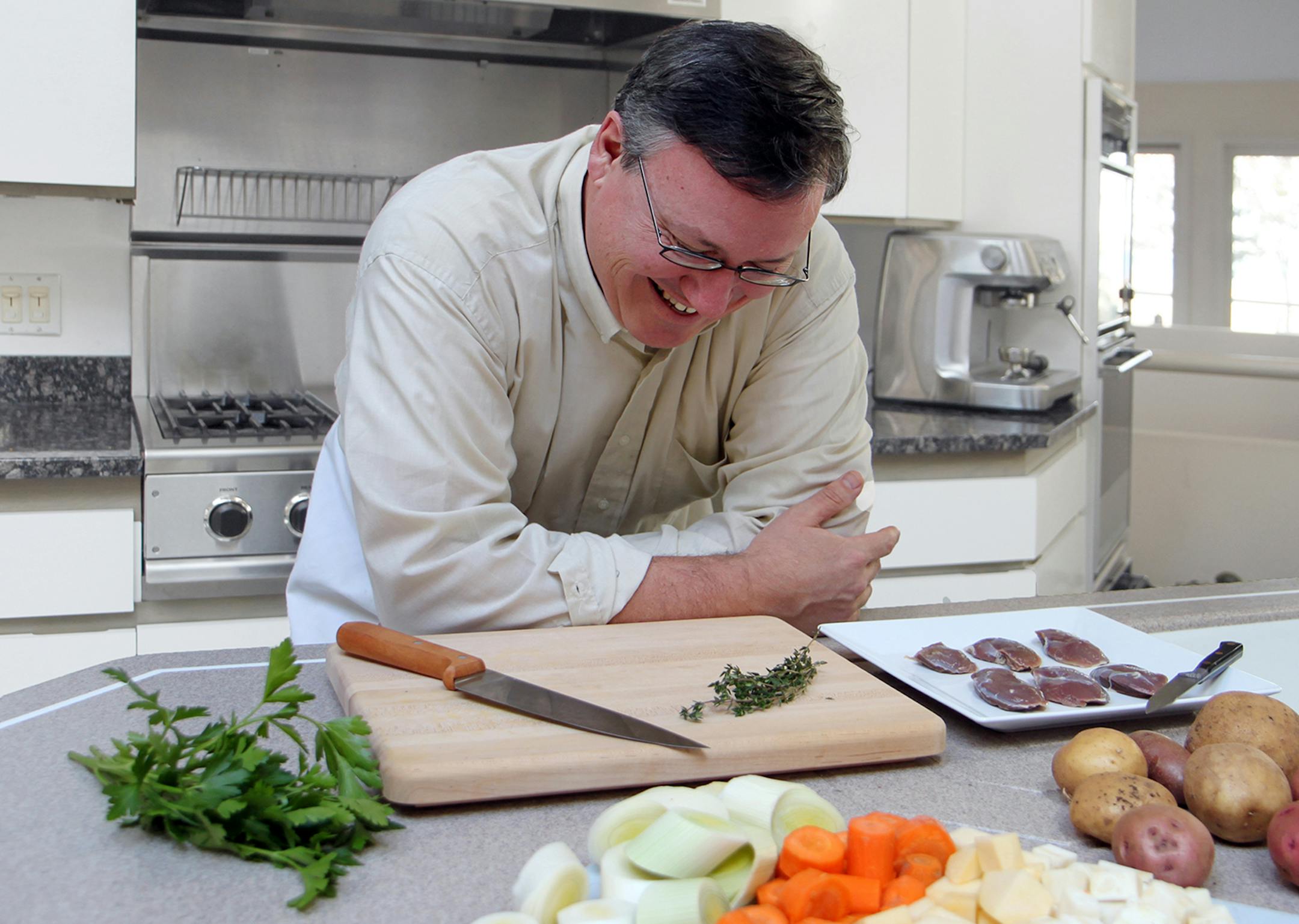 Photo by Mary Jo Hoffman, Special to the Star Tribune Steve Hoffman cooking duck breast, for hunting story by Steve Hoffman.