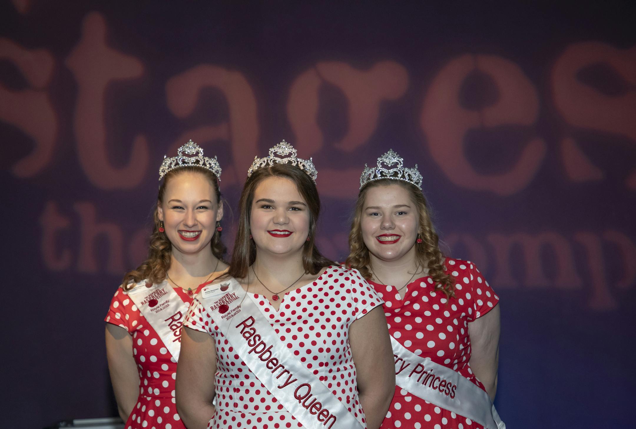 Hopkins Raspberry Festival Queen Ashley Normandin, center, with princesses Kallie Jo Ascheman and Katie Costello.