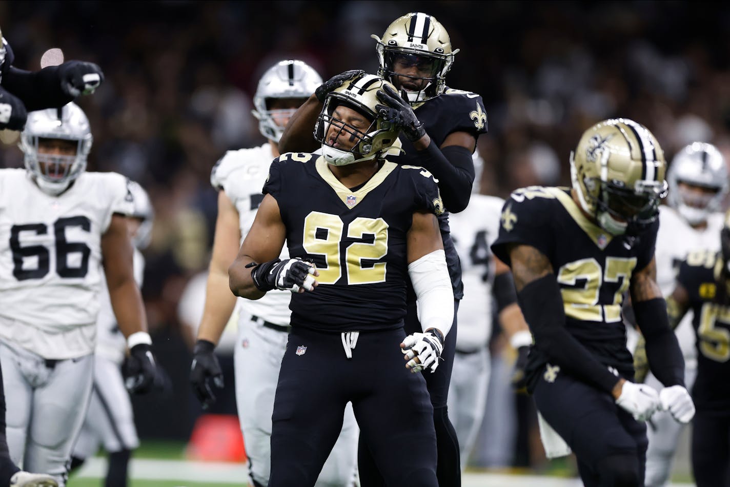 New Orleans Saints defensive end Marcus Davenport (92) celebrates after a play during the first half of an NFL football game against the Las Vegas Raiders Sunday, Oct. 30, 2022, in New Orleans. (AP Photo/Rusty Costanza)