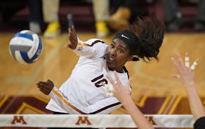 Minnesota right side hitter Stephanie Samedy (10) spiked the ball against University of Northern Iowa in the second set Saturday. ] AARON LAVINSKY &#x