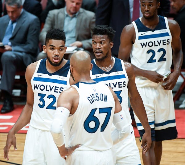 Minnesota Timberwolves center Karl-Anthony Towns (32), forward Taj Gibson (67), forward Jimmy Butler (23) and guard Andrew Wiggins (22) talked things 