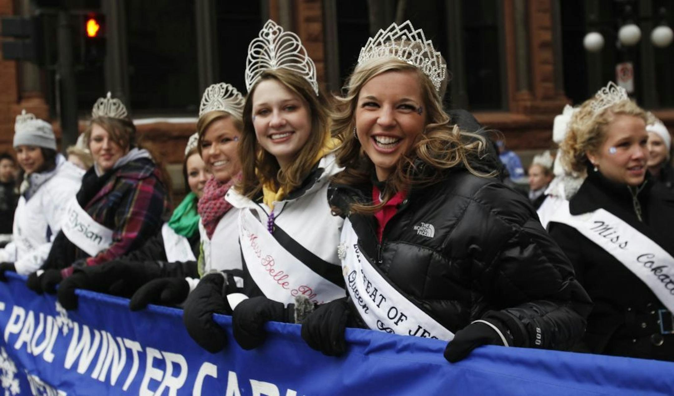 The King Boreas Grande Day Parade made its way down 5th St. between Mear and Rice Parks in downtown St. Paul. In this photo:] St. Paul Winter Carnival Visiting Ambassadors head down 5th.