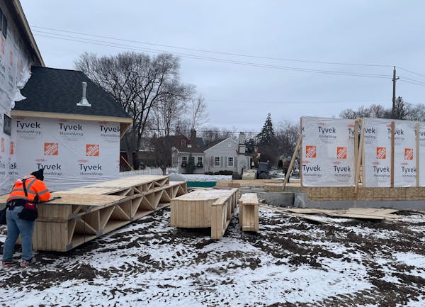 Housing construction fell 35% in the Twin Cities in 2023 compared with 2022. That makes sights like this — two houses being built next to each other