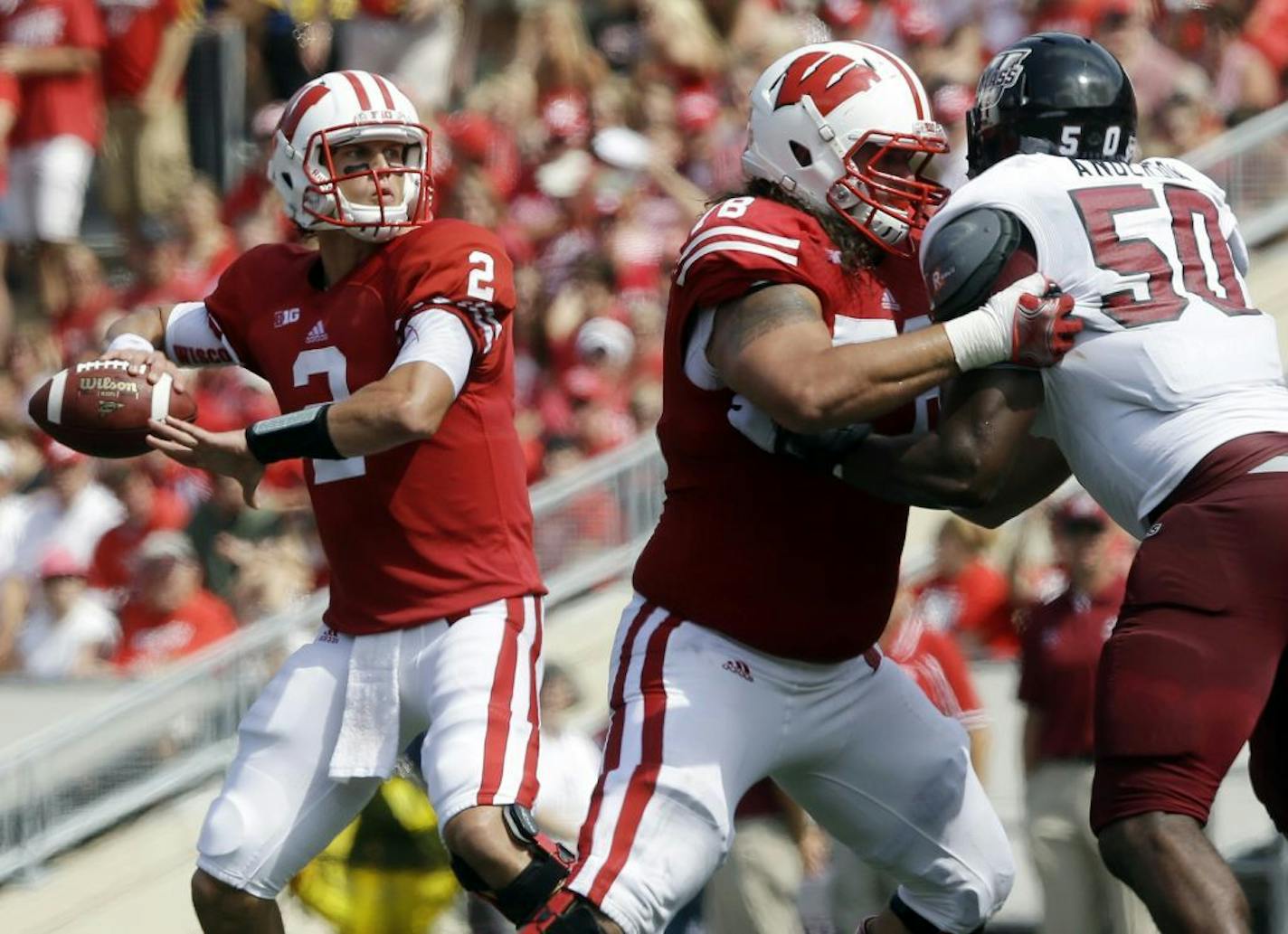 Wisconsin quarterback Joel Stave drops back to throw during the first half of an NCAA college football game against Massachusetts Saturday, Aug. 31, 2013, in Madison, Wis.