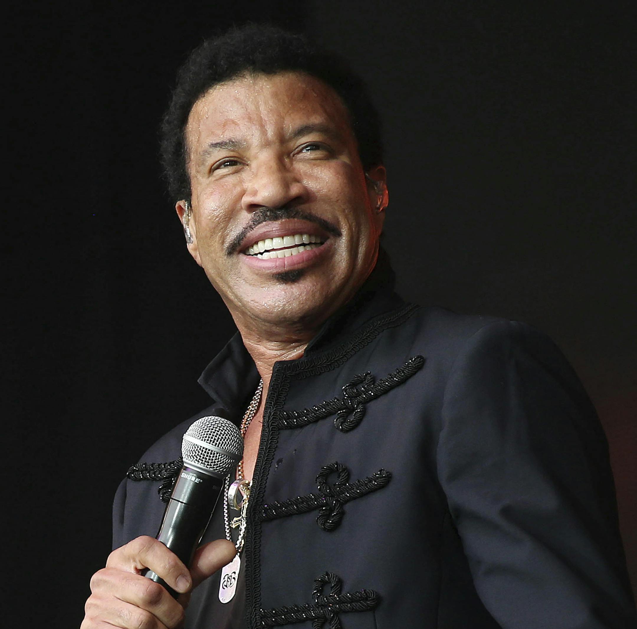 FILE - In this June 28, 2015, file photo, Lionel Richie performs on the Pyramid stage at Glastonbury music festival on Worthy Farm, Glastonbury, England. Richie and mariah announced Monday, Dec. 12, 2016, they are joining forces for the All The Hits Tour, which kicks off in Baltimore on March 15, 2017. (Photo by Joel Ryan/Invision/AP, File)
