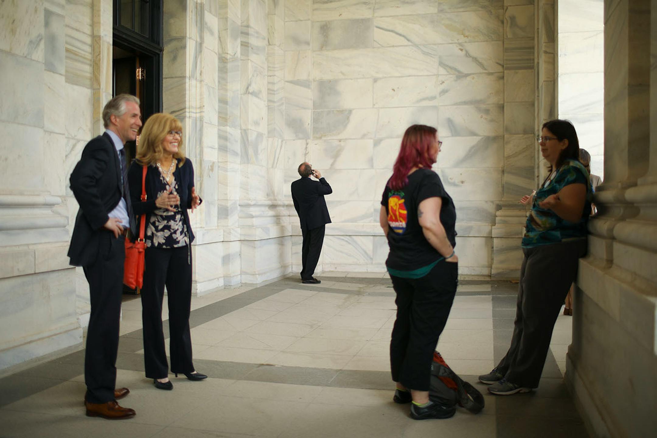 The porch on the second floor of the State Capitol was open Monday afternoon and lawmakers and others took full advantage.