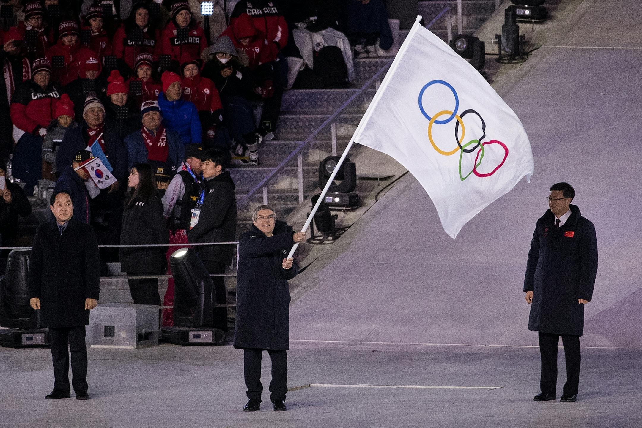IOC President Thomas Bach waved the Olympic flag at Pyeongchang Olympic Stadium during Closing Ceremony on Sunday.