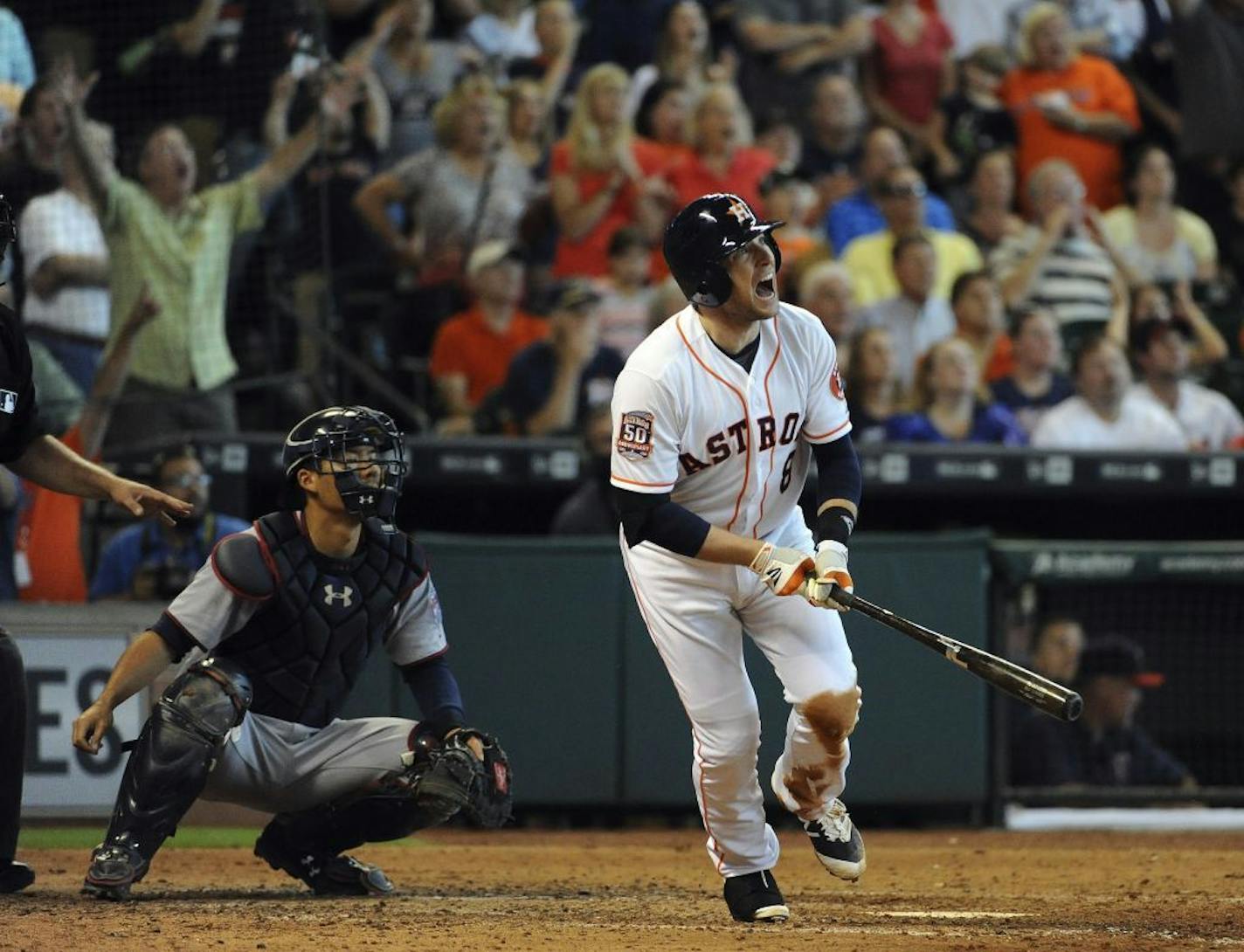 The Astros' Jed Lowrie watched his grand slam in the seventh inning against the Twins on Sunday.