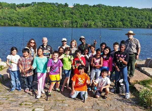 Pickeral Lake providing both fun and fish to members of the Outdoor Club of Battlecreek Elementary School in St. Paul. The club is a joint project of 