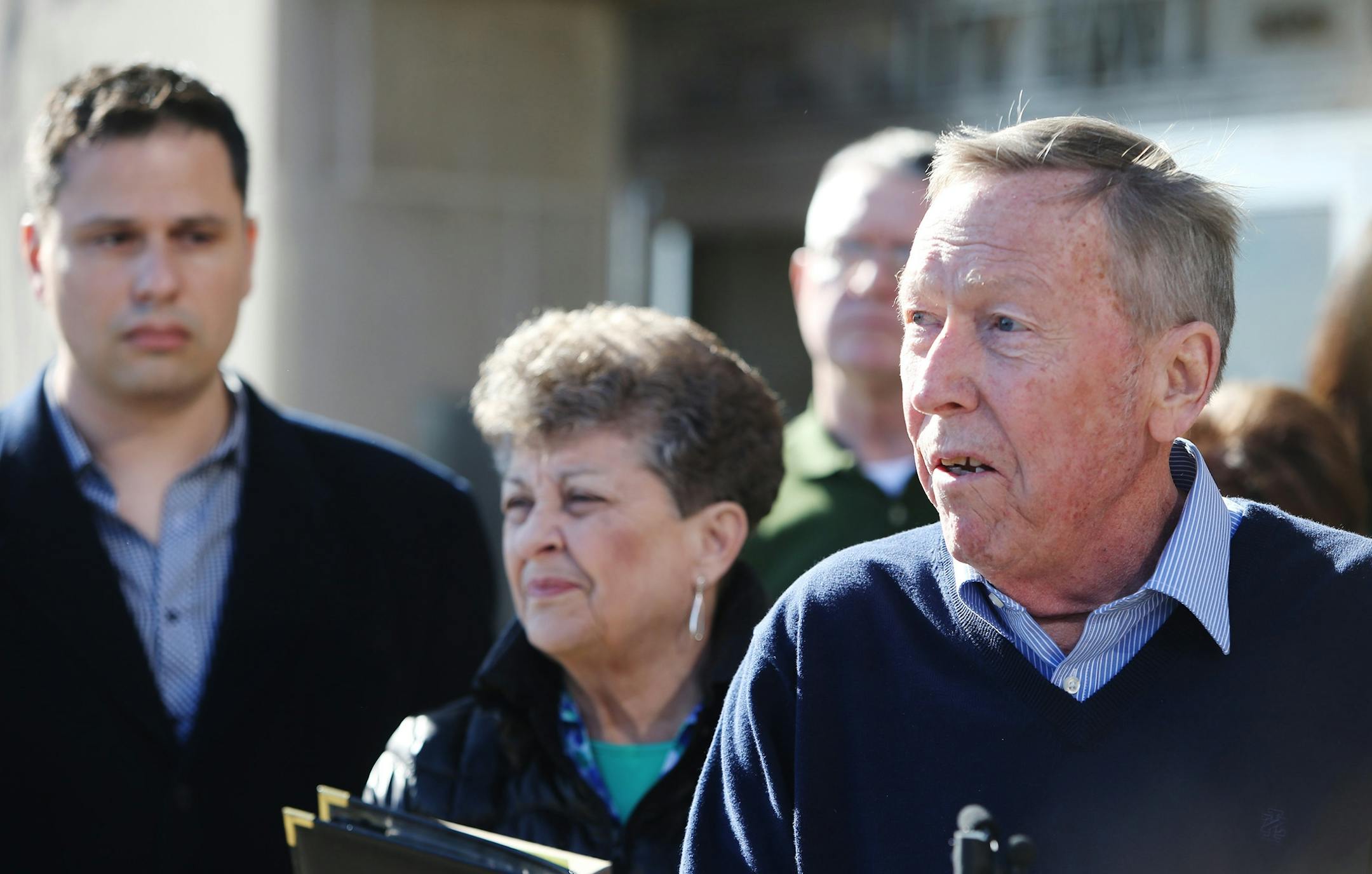Lyle "Ty" Hoffman was sentenced to 25 years Tuesday for fatally shooting his former partner, Kelly Phillips, and then leading police on a month-long chase throughout the metro. In the photo, Phillips' father Jim, right, spoke to media members as Phillips' fiance, Nathon Bailey, left, and Phillips' mother Judy looked on.