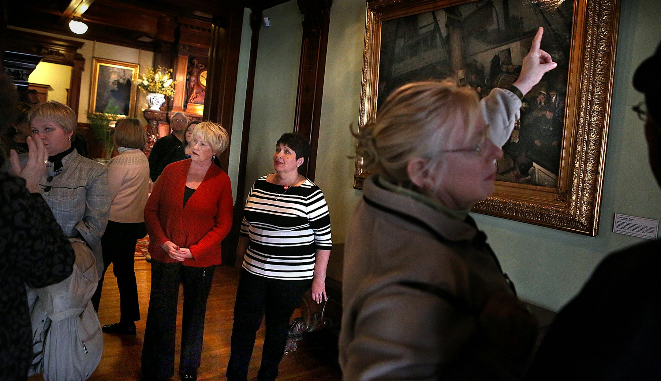 Linda Wicklund (in red) tours the American Swedish Institute with longtime friend, Maiia Zuieva at her side.