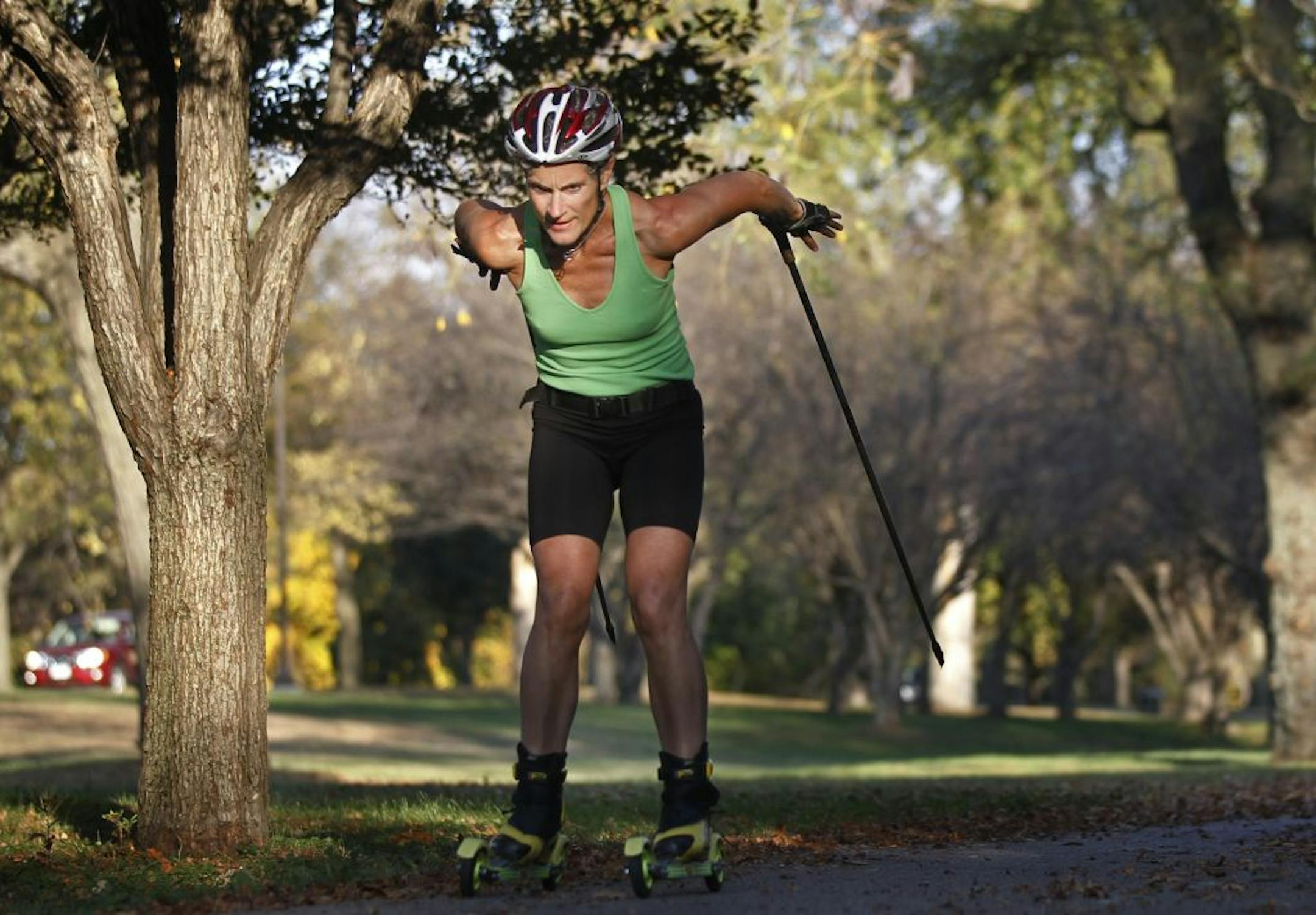 Carol Markham-Cousins trained for the cross-country ski race season on roller skis near Lake Nokomis.