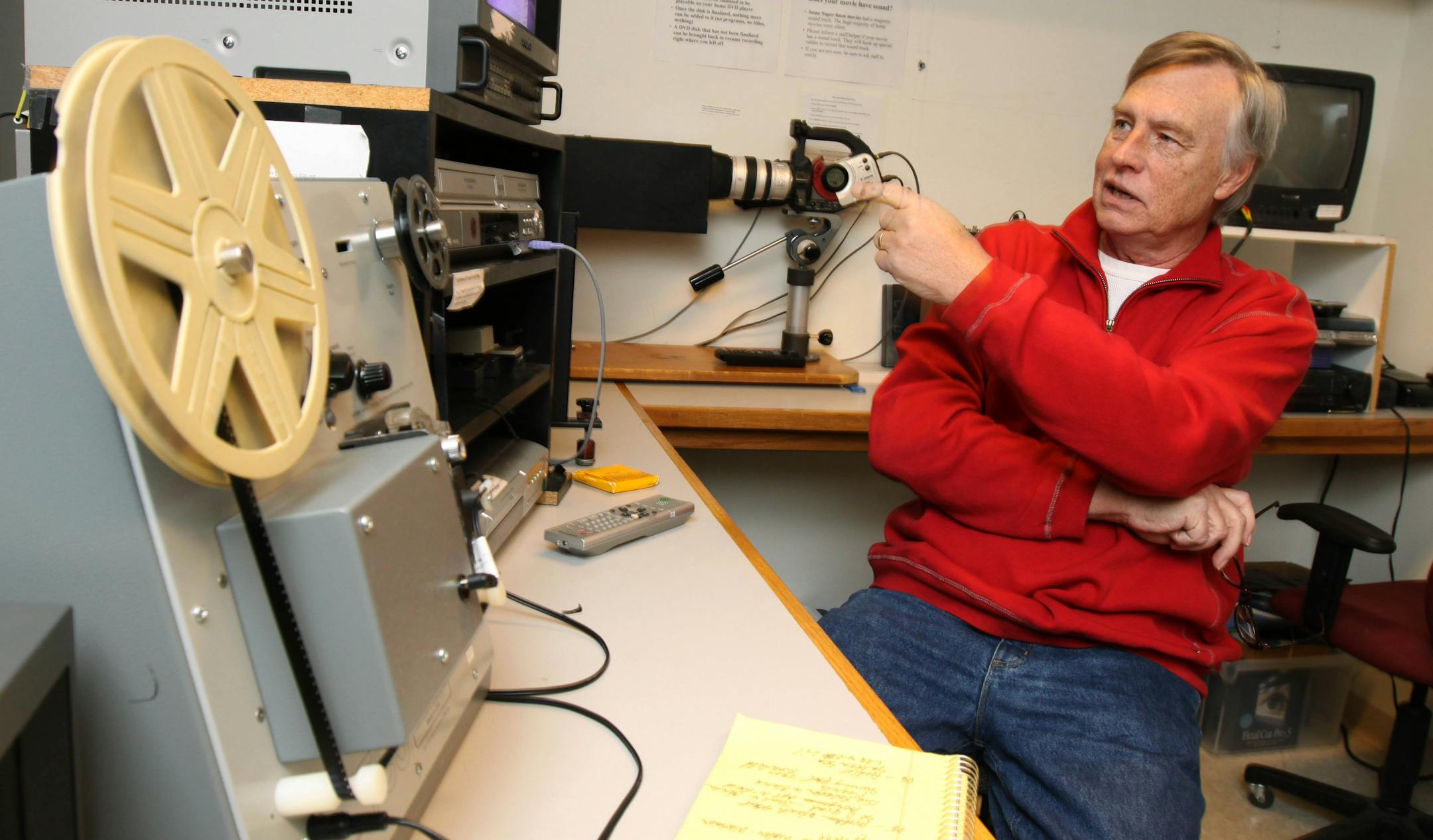 Michael Oiseth of Bloomington loaded his father's 8mm film onto a transfer machine at the Edina Art Center Media Studios. Oiseth was transferring the old family film to DVDs which he could then edit on his computer.