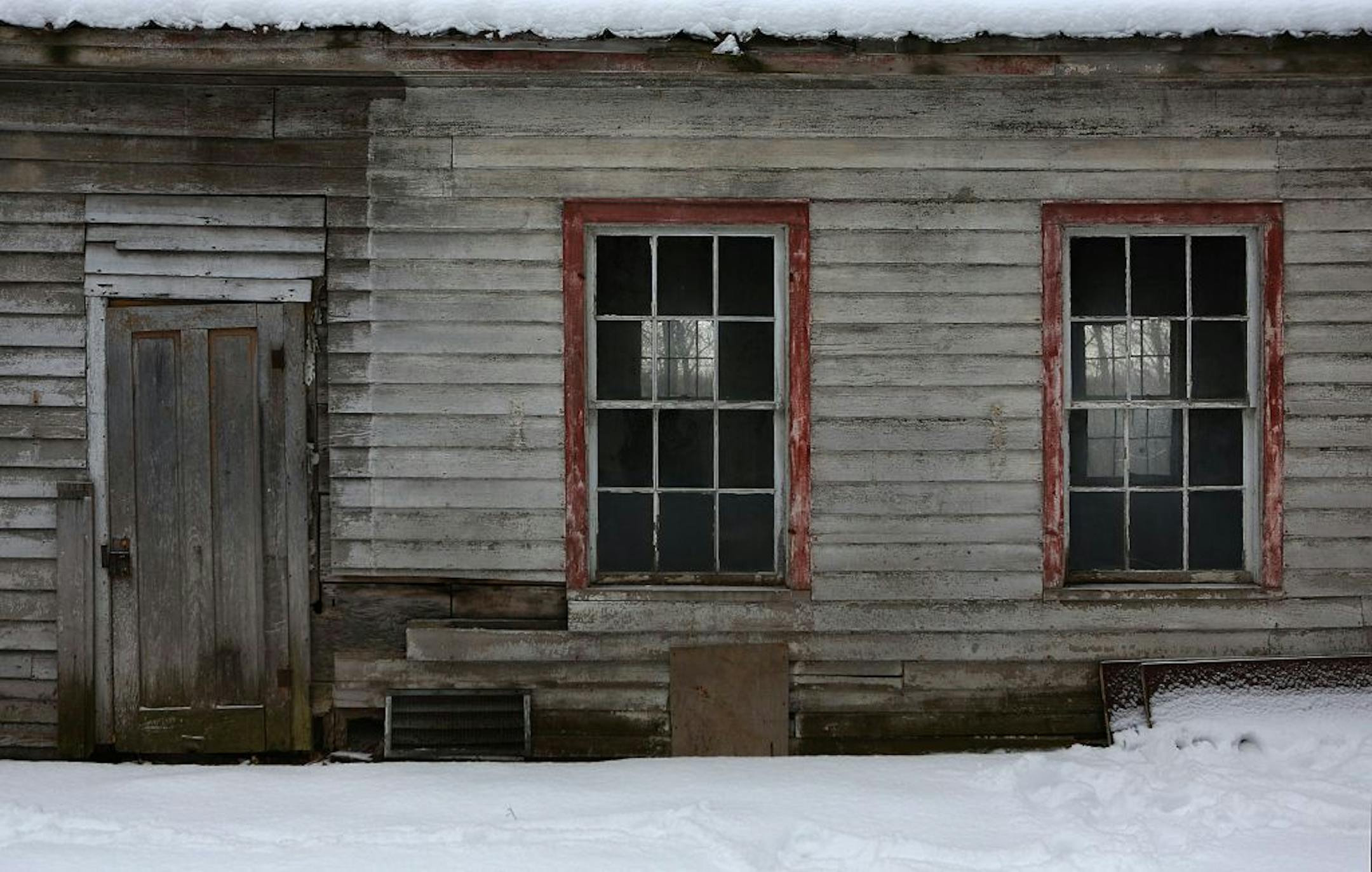Nestled on an easy-to-miss hillside at the southern end of St. Croix Trail, a graying white wooden building standing on a stone foundation is probably the earliest school building in the state.