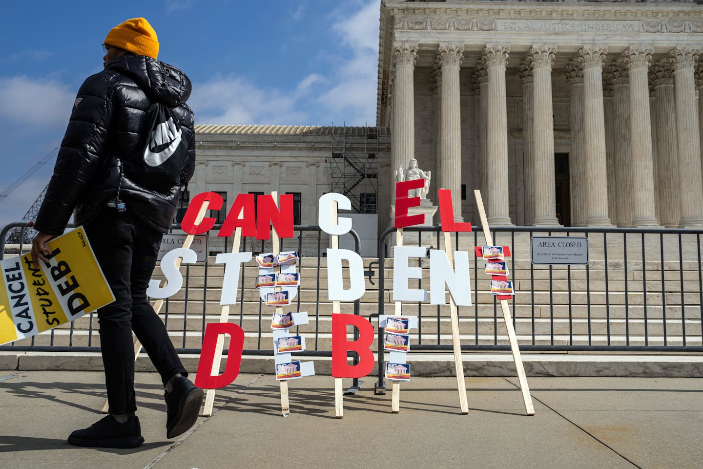 A sign outside the U.S. Supreme Court building reads, "Cancel student debt."