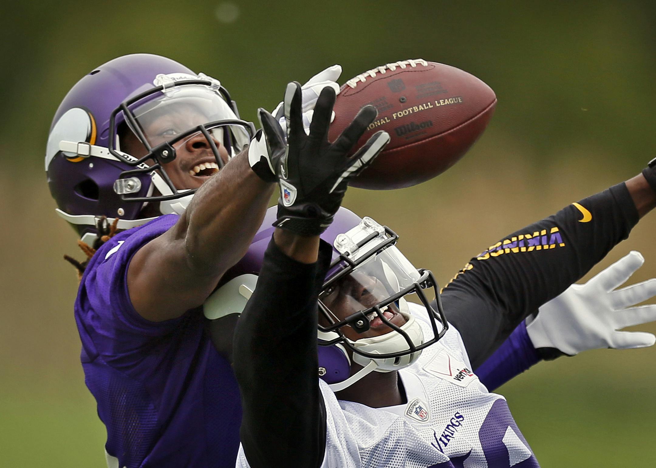 Cordarrelle Patterson (left) and Xavier Rhodes battled for a ball at Winter Park.