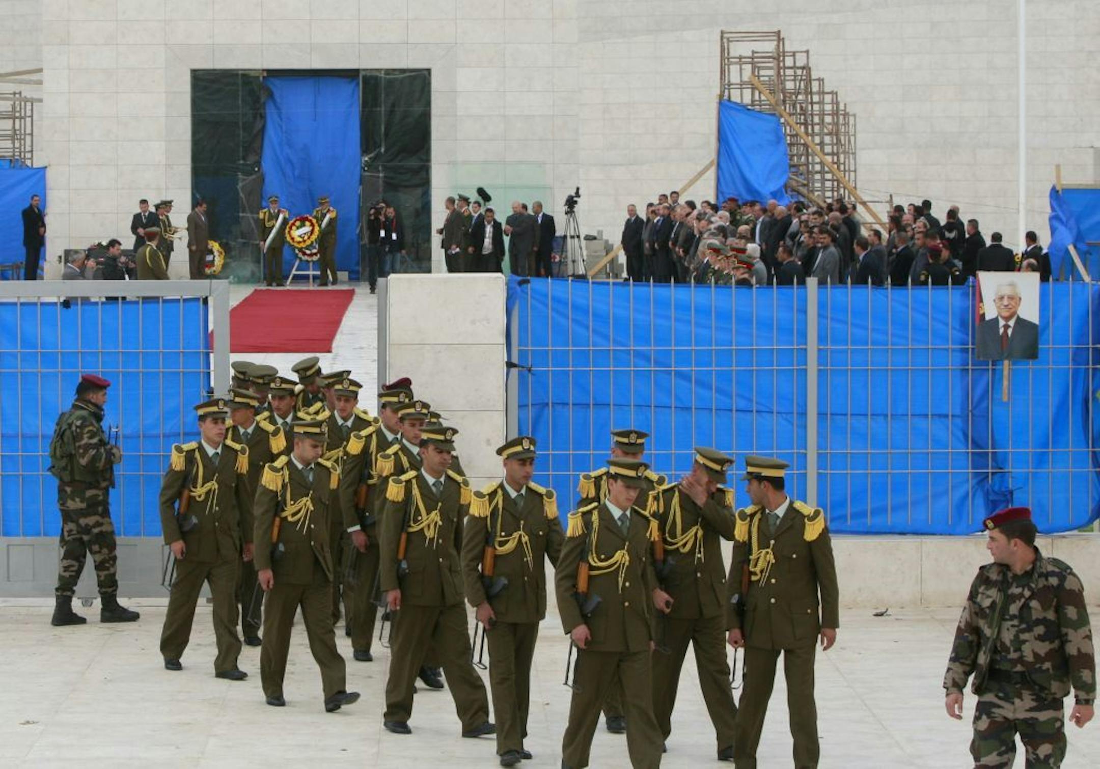 Members of a Palestinian honor guard leave after a reburial ceremony for late Palestinian leader Yasser Arafat, in the West Bank city of Ramallah, Tuesday, Nov. 27, 2012. Palestinian authorities on Tuesday opened Yasser Arafat's grave and foreign experts took samples from his remains as part of a long-shot attempt, eight years after the iconic leader's mysterious death, to determine whether he was poisoned, as relatives and some political successors have claimed.
