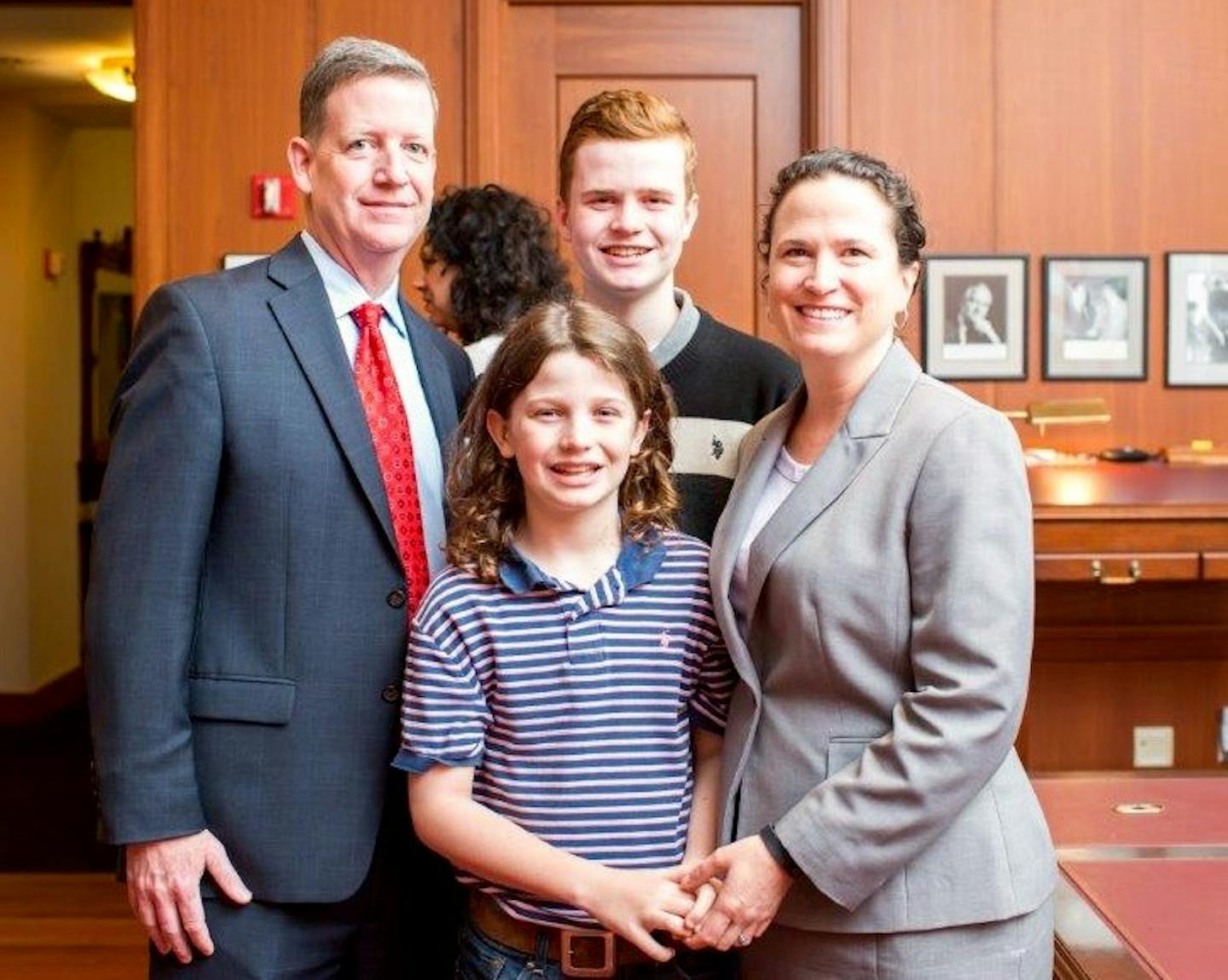 Dan Rogan, sons Riley and Finley, and his wife, Kate Menendez.