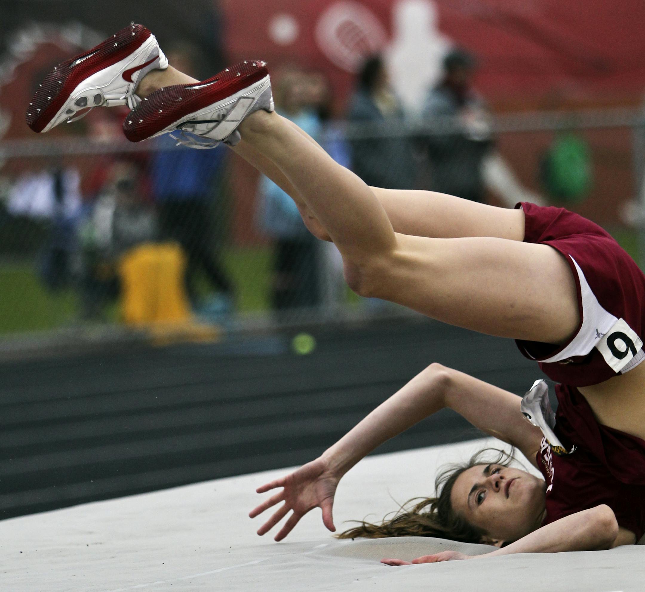 Lakeville South's Caraline Slattery (137) lands after clearing the bar in the long jump during the 3A True team track state meet Friday, May 17, 2013 at Stillwater High in Stillwater, MN.](DAVID JOLES/STARTRIBUNE) djoles@startribune.com True team track state meet for Class 3A Friday, May 17, 2013 at Stillwater High in Stillwater, MN.**Caraline Slattery,cq