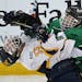 Mahtomedi�s Jack Gunderson (left) collided with East Grand Fork�s Austin Monda in the second period.