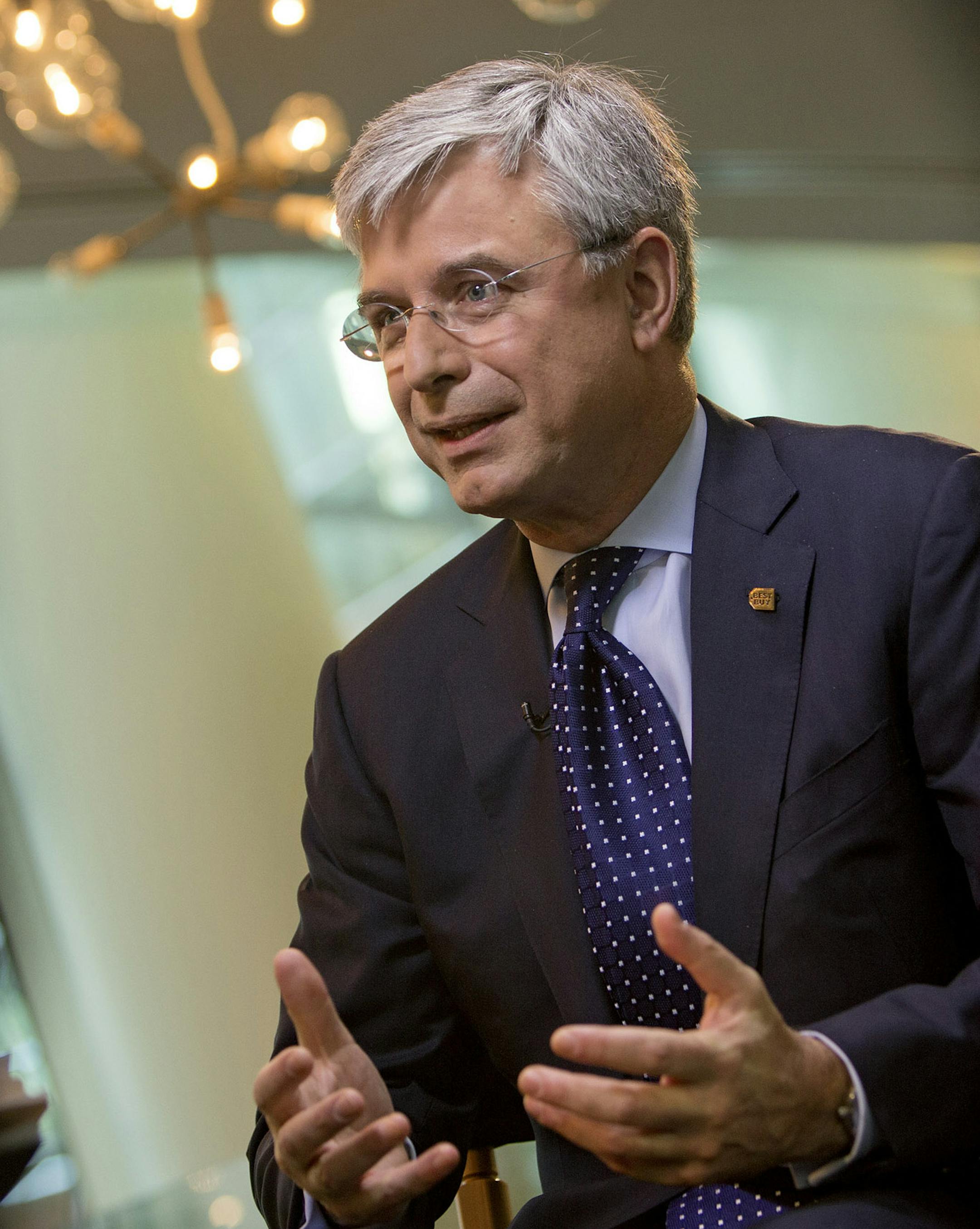 Hubert Joly, president and chief executive officer of Best Buy Co., speaks during an interview in New York, U.S., on Wednesday, Nov. 14, 2012. Joly is considering buying consumer electronics brands as a way of locking up exclusive merchandise as he seeks to turn around the worldís largest gadgets retailer. Photographer: Scott Eells/Bloomberg *** Local Caption *** Hubert Joly ORG XMIT: 156528301