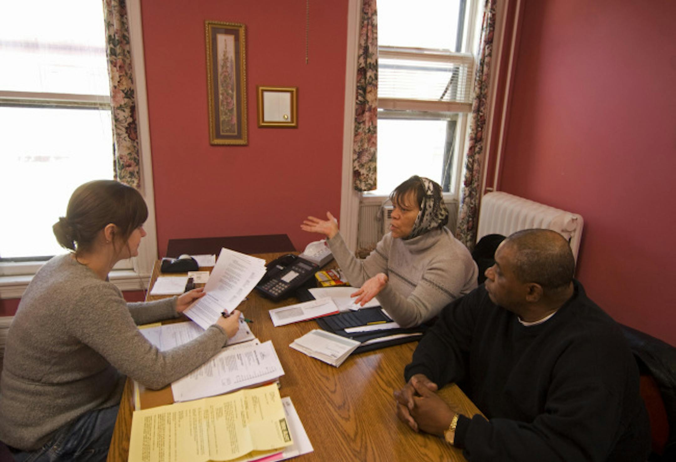 Habitat for Humanity financial counselor Melissa Hansen talked over options with Shandra and Thomas Floyd, who are preparing for mortgage foreclosure. There was little in the way of options.