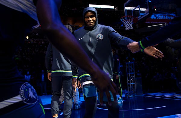 Anthony Edwards (1) of the Minnesota Timberwolves is greeted by teammates during introductions.