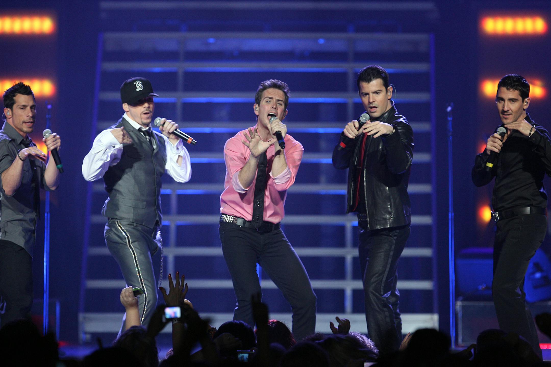 The older but still fun-loving New Kids on the Block, from left, Danny Wood, Donnie Wahlberg, Joe McIntyre, Jordan Knight and Jonathan Knight drew a mostly female crowd of 13,000 to the Xcel Center in St. Paul on Tuesday night. See the set list at www.startribune.com/poplife.